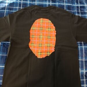 A Bathing Ape Black Tee with Orange Plaid Graphic